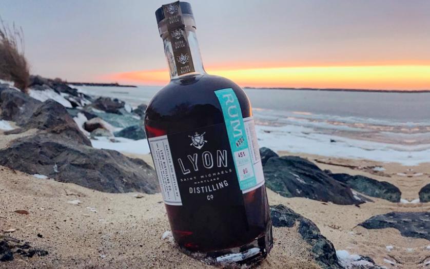 Bottle of Lyon Rum on a beach