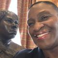 Julia Bouie selfie with Harriet Tubman's statue at the Maryland House